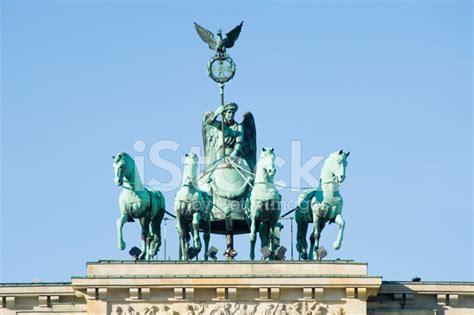 Hello folks can anyone tell me anything about the meaning of the statue on top of the brandenburg gate. Quadriga Statue on The Brandenburg Gate IN Berlin Germany ...