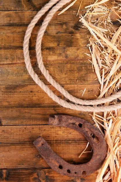 Premium Photo American West Still Life With Old Horseshoe And Cowboy