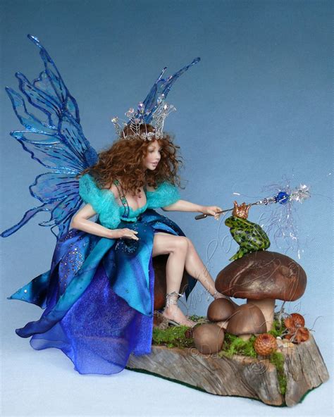 A Fairy Figurine Sitting On Top Of A Mushroom