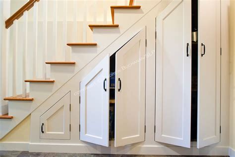 It can add an abundance of extra storage space not technically under the stairs, but try using the stairs themselves for additional storage. under stair cabinet built ins | Custom cabinets built ...