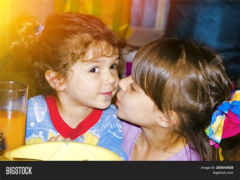 Girl Kisses Her Sister Image And Photo Free Trial Bigstock