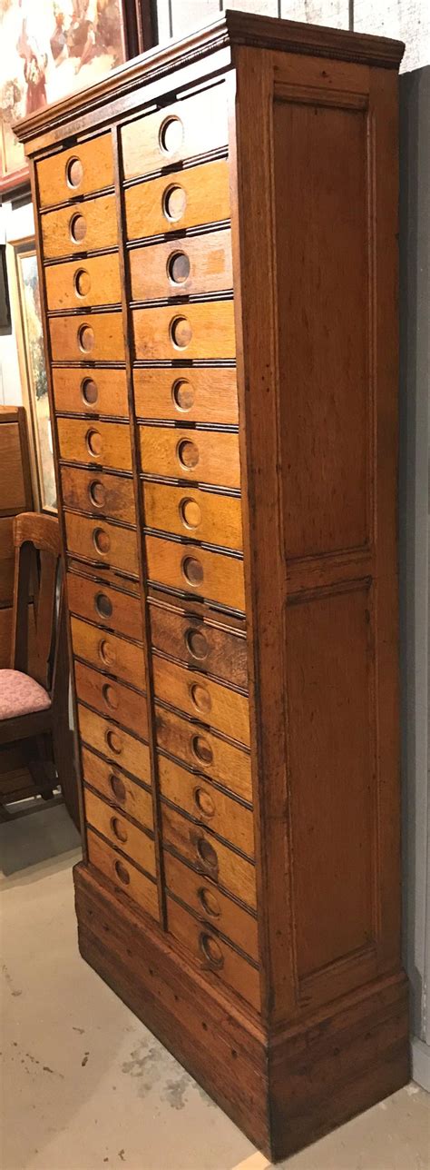 A filing cabinet (or sometimes file cabinet in american english) is a piece of office furniture usually used to store paper documents in file folders. Amberg's Imperial Letter File Multi-Drawer Cabinet, circa ...
