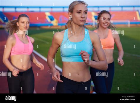 Athlete Woman Group Running On Athletics Race Track Stock Photo Alamy