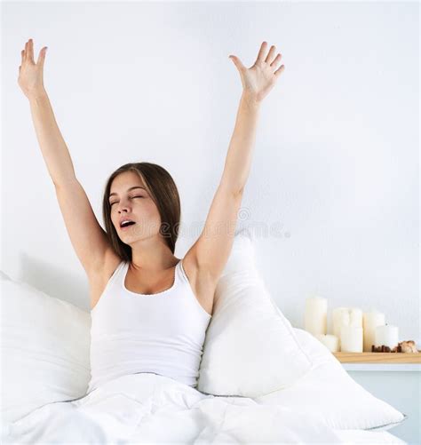 An Attractive Young Woman Stretching In Bed After Waking Up Stock Image Image Of Routine Wake