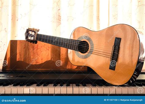 Guitar On Piano Keyboard Stock Photo Image Of Acoustic 91107150