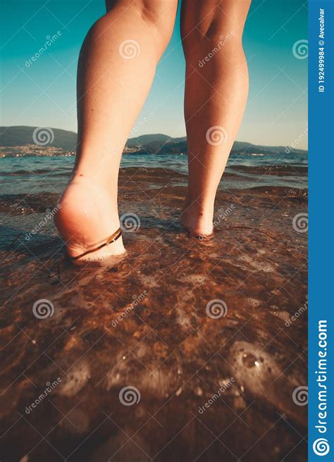 A Woman Entering In The Sea At The Beach Stock Photo Image Of Caucasian Beach