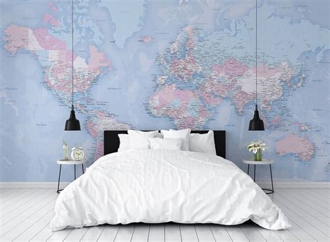 A Bedroom With A Large Map On The Wall And Two Nightstands Next To It