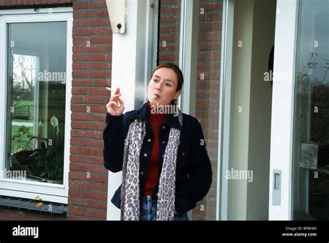 Woman Smoking Outside One Only Smokeing In Doorway Stock Photo Alamy