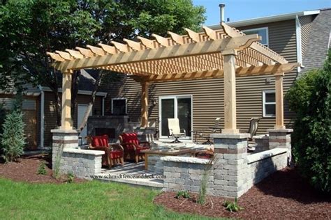 Pergola columns and cross beams. Approx. 16' x 16' cedar patio featuring stone columns and ...