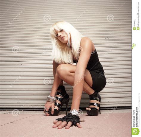 Woman Crouching On The Ground Stock Image Image