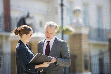 Business People Talking Outdoors Stock Photo Dissolve