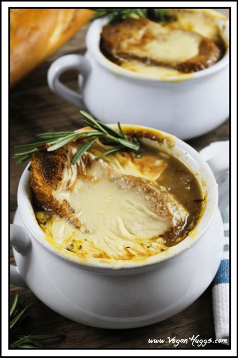 Two White Crocks Of Vegan French Onion Soup Topped With Bread And