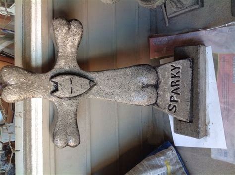 Here are my Sparky and Goodbye Kitty cement tombstones, painted and