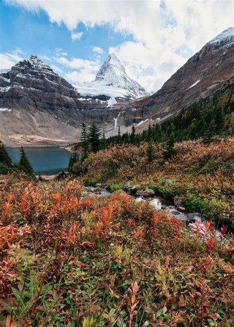 Mount Assiniboine With Lake Magog In Autumn Forest At Provincial Park