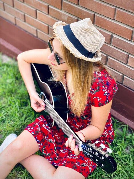 Premium Photo Teenager Beautiful Girl Playing Guitar Outside