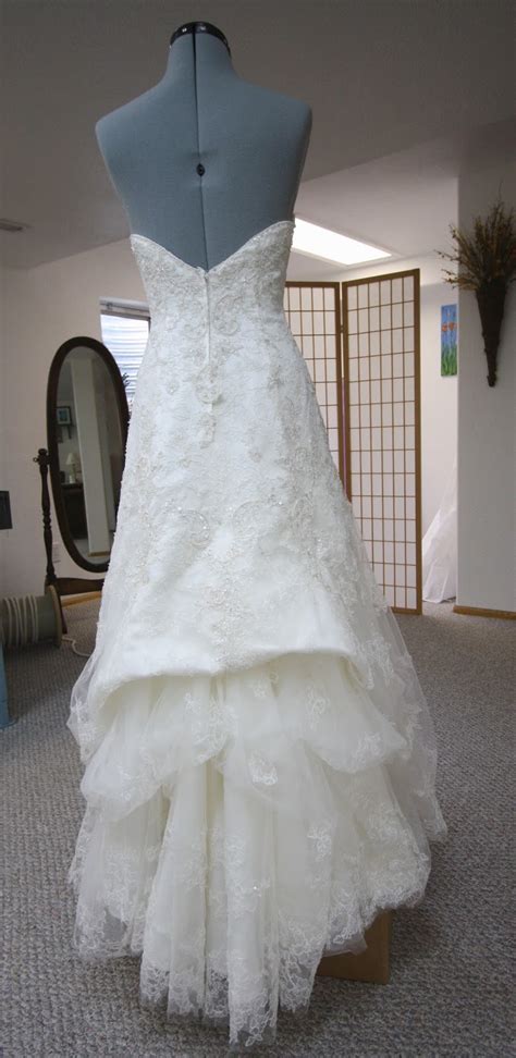 The thrill of the hunt is followed by numerous fittings and bridal portraits. His, Hers and Ours DIY: WEDDING GOWN BUSTLE