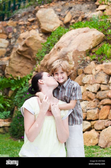 Mother Kissing Her Son Stock Photo Alamy