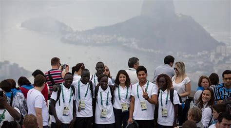 Mixed team for sea games 2021. Athletes in Rio 2016 Olympics' refugee team carry flag for ...