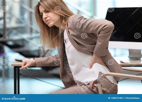 Young Woman Suffering From Back Pain In Offic Stock Photo Image Of