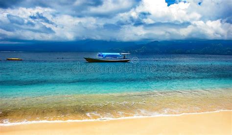 Wooden Boat Longtail Anchored Near A Tropical Island Tropical