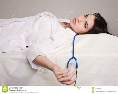 ''lying is the correct answer. Lifeless Nurse Lying On The Sofa Royalty Free Stock Photo ...