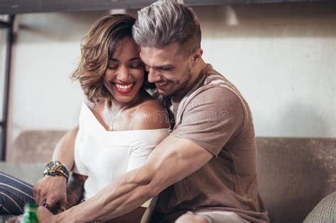 Two Happy Mixed Race Couple Having Fun At The Coffee Shop Stock Image