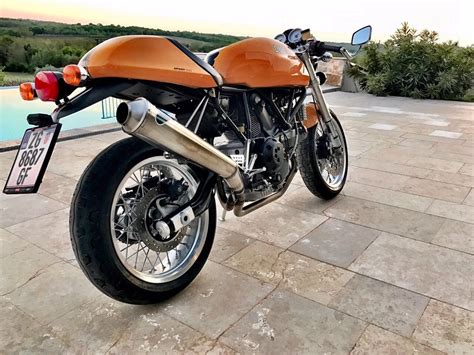 This pristine sport classic has been meticulously maintained and owned by a ducati technician. 2006 Ducati sport 1000 SOLD | Car and Classic