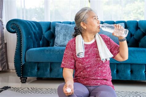 Senior Woman Hold Water Drink In Hand After Workout Stock Photo Image