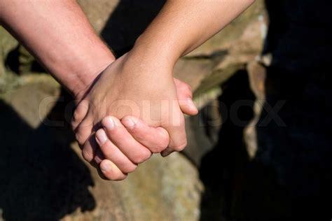 A Closeup Of A Man And Woman Holding Hands Stock Image Colourbox