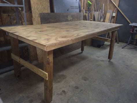 The table is oak veneer. My most recent project: a 4X8 shop-stock table. Simple posts and casters, plywood, 1x4 braces ...