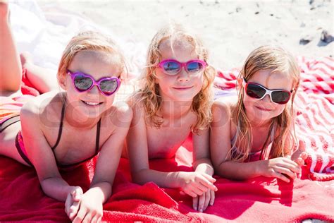 Caucasian Girls Enjoying The Summer Heat In The Beach Stock Image