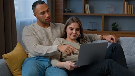 African American Latin Couple Look At Laptop Multiracial Woman And Man