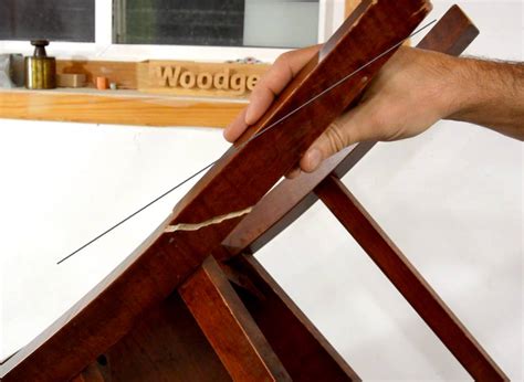 Proper repair of a glued wooden chair requires removing all the old glue while taking care not to scrape away any of the wood. Repairing a broken chair leg