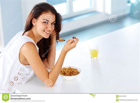 wellness concept woman having breakfast and smiling healthy ea stock image image of drinking