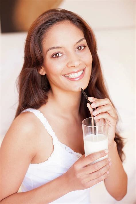 Woman Drinking Milk Photograph By Ian Hooton Science Photo Library