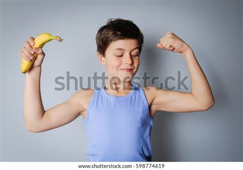 Male Caucasian Child Flexing His Biceps Stock Photo 598774619