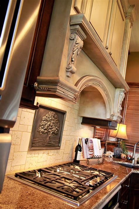 And still, others want to take it to the end of the wall. hood over stove stop, painted woodwork, tile backsplash ...