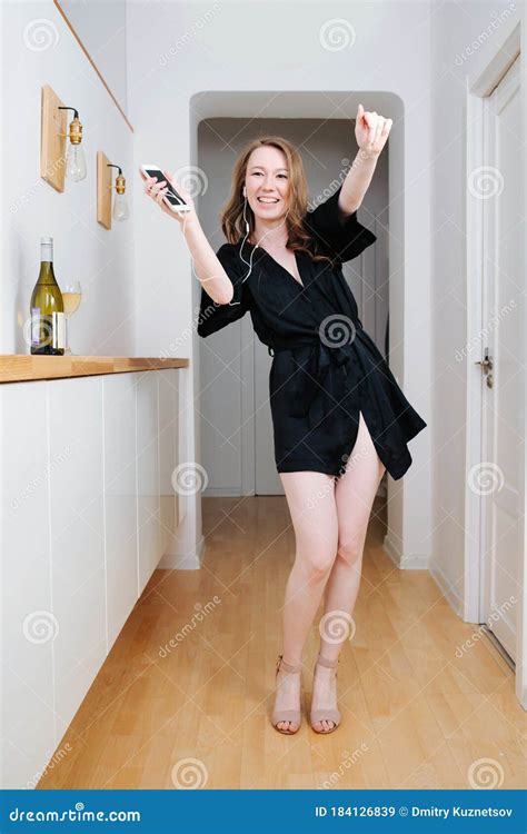 Girl Partying At Home Alone She`s Listening Music Dancing And Drinking Wine Stock Image