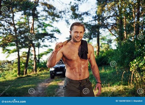 Close Up Portrait Of Woodsman With Axe In Hand Handsome Shirtless Man