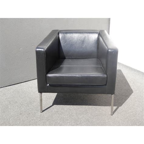 The upholstery is faux leather with a frame of birch wood and plywood. Contemporary Black Leather Chrome Accent Chair | Chairish