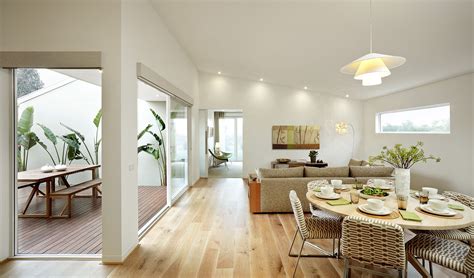 A Bright And Spacious Living Area Showcasing Aandl Doors And Windows