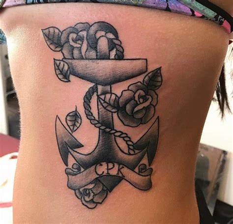 A black and gray anchor with white highlights is accented by a trio of flowers in this tattoo rendered on the topside of the wearer's foot. 95+ Best Anchor Tattoo Designs & Meanings - Love of The ...