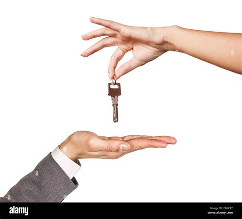 Hand Giving A Key Stock Photo Alamy
