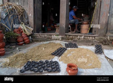 A Potter Makes Earthen Lamps For The Upcoming Tihar Festival In
