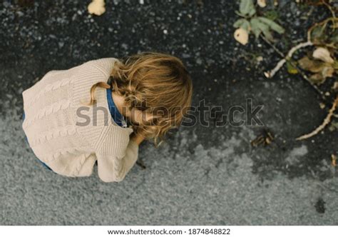 Little Girl Bending Over Inspect Something Stock Photo 1874848822