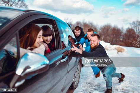 People Pushing Car Photos And Premium High Res Pictures Getty Images