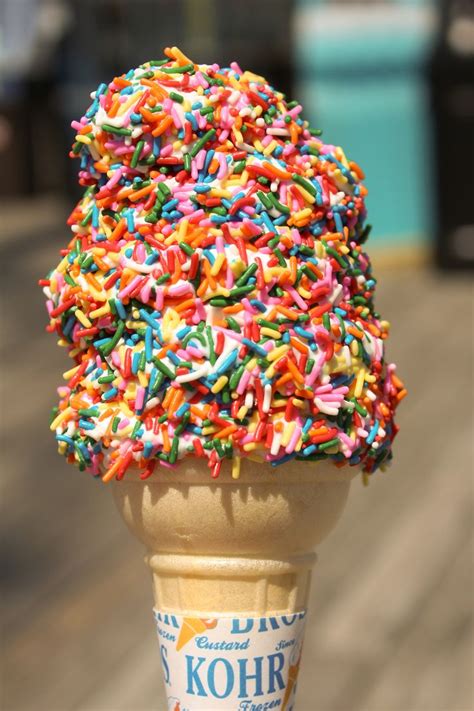Rainbow Sprinkles On Soft Serve Vanilla Ice Cream One Of