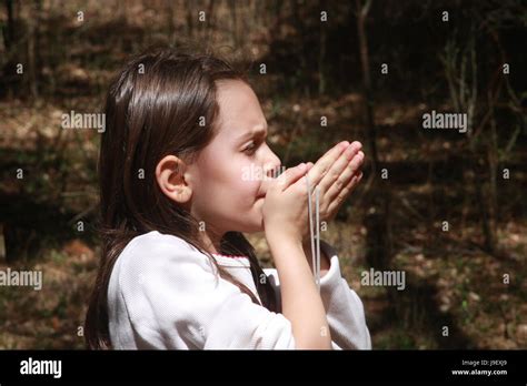 Young Girl In The Woods Hand Whistling Stock Photo Alamy