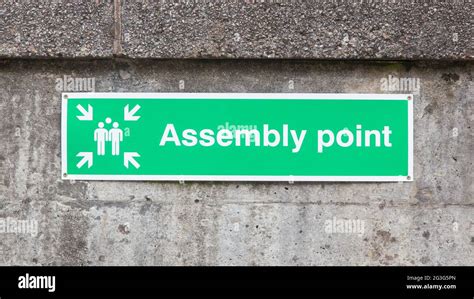 Green Plastic Assembly Point Sign Stock Photo Alamy
