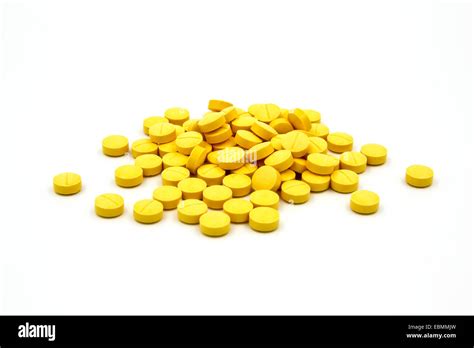 Yellow Pills On White Background Stock Photo Alamy